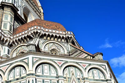 Low angle view of ornate building against sky