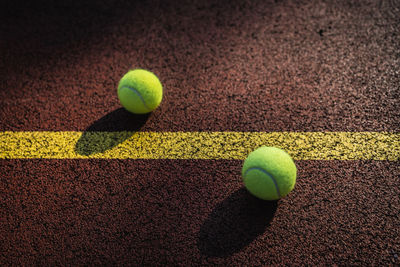 High angle view of tennis balls on field