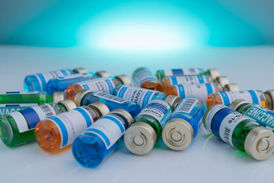Close-up of multi colored bottles on table