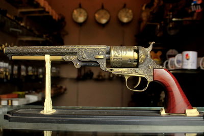 Close-up of antique gun at museum