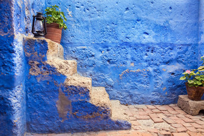 Close-up of wall against blue sky