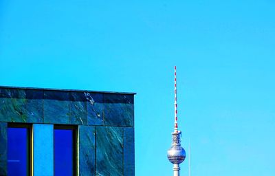 Communications tower against blue sky