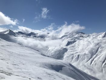 Scenic view of snowcapped mountains against sky