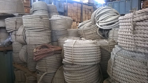 Close-up of rope tied to stack of ropes