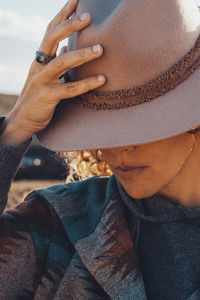 Midsection of man wearing hat