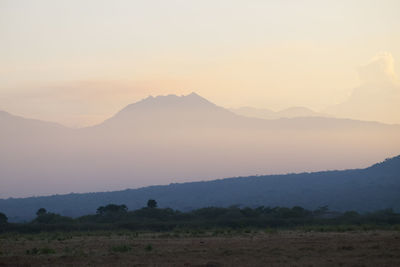 Scenic view of mountains against sky during sunset