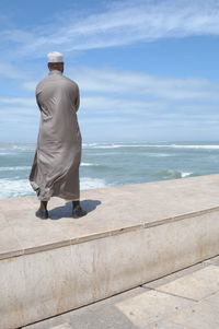 Woman standing on beach