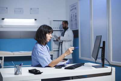 Young woman using laptop at home