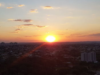 Scenic view of sunset over city