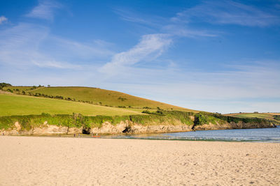 Scenic view of landscape against blue sky