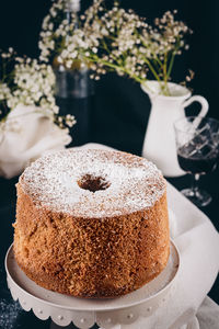 Still life with cake and white flowers