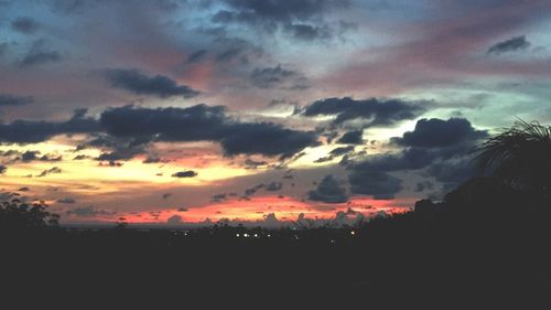 Silhouette landscape against sky during sunset