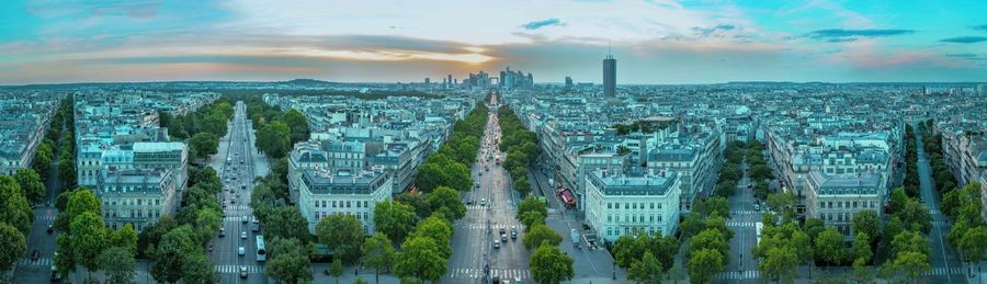 Panoramic view of cityscape against cloudy sky