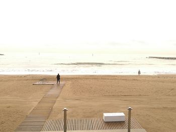 View of people walking on beach