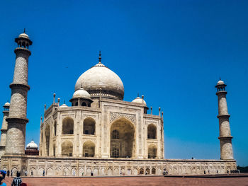 Low angle view of historic building against clear blue sky, taj mahal