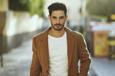 Portrait of young man standing outdoors