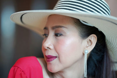 Portrait of smiling young woman looking away