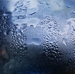 Full frame shot of wet glass window