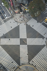 High angle view of person walking on street in city