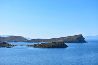 Scenic view of sea against clear blue sky