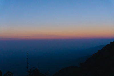 Scenic view of silhouette landscape against sky during sunset