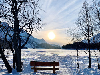 Scenic view of snow covered mountains against sky during sunset