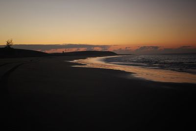 Scenic view of sea against clear sky during sunset