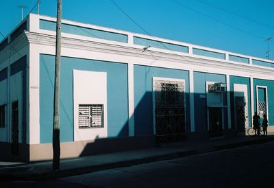 Exterior of building against clear blue sky in city