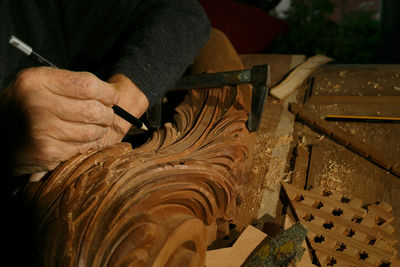 Cropped hand of man working at workshop