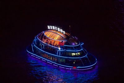 High angle view of illuminated ship at night