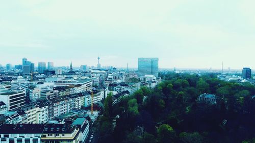 High angle view of buildings in city against sky