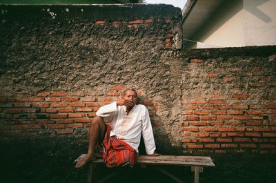 Man sitting on wall