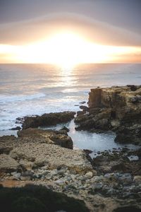 Scenic view of sea against sky during sunset