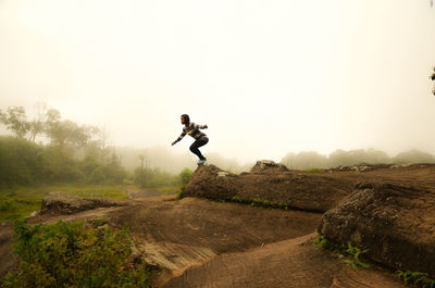 Man on mountain against sky