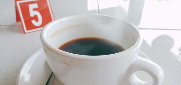 Close-up of coffee cup on table