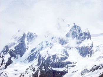 Scenic view of snow covered mountains