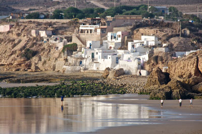 Scenic view of beach by town