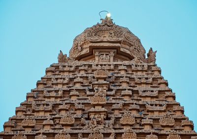 Low angle view of historical building against clear blue sky