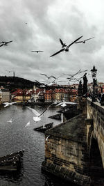 Buildings against cloudy sky