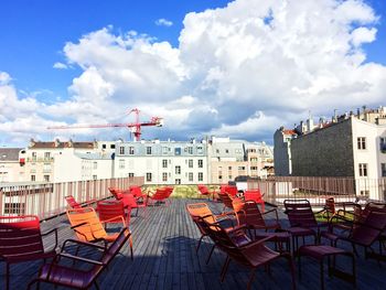 Buildings against cloudy sky