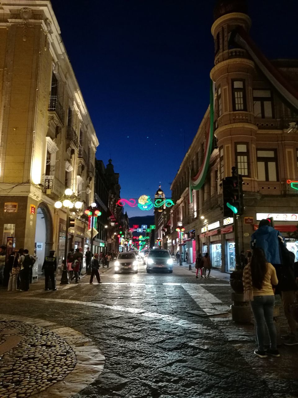 architecture, building exterior, built structure, real people, large group of people, night, men, walking, illuminated, street, women, outdoors, lifestyles, city, clear sky, sky, people