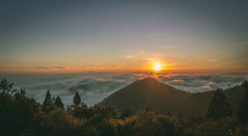 Scenic view of mountains against sky during sunset