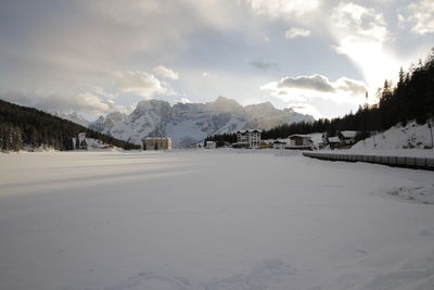 Scenic view of snow covered mountains against sky