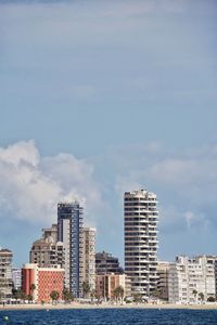 Modern buildings in city against sky