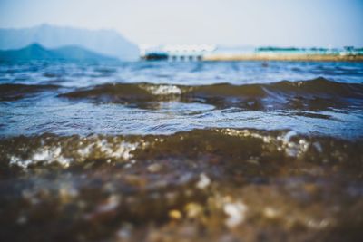 Close-up of wave in sea against sky