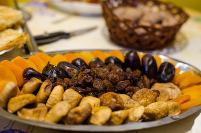 Close-up of dry fruits in plate on table