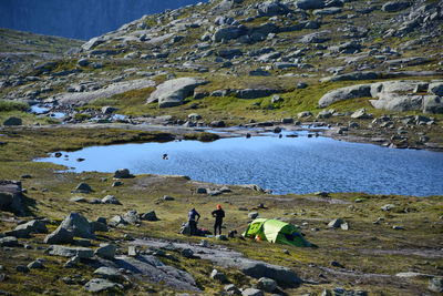 People camping at lakeshore