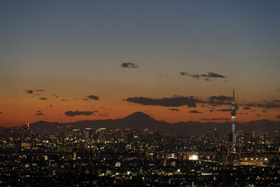 Aerial view of city lit up at night