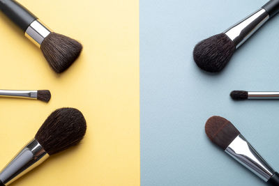 High angle view of make-up brushes on table