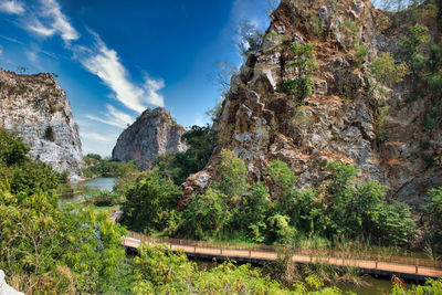 Panoramic view of trees and rocks against sky